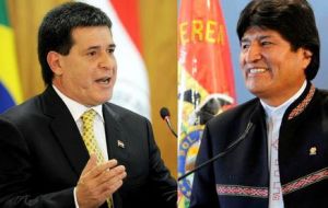 Vecinos y con desempeños sólidos, Horacio Cartes y Evo Morales